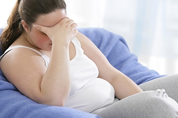 sad obese woman coping PCOS