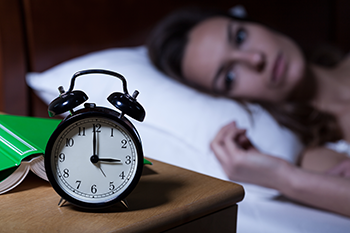 insomniac woman cannot sleep sleep after late workout