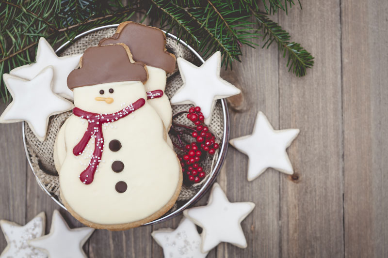 christmas snowman cookie on wood table
