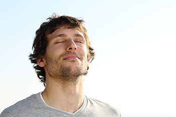 young man breathing deeply avoid energy drinks